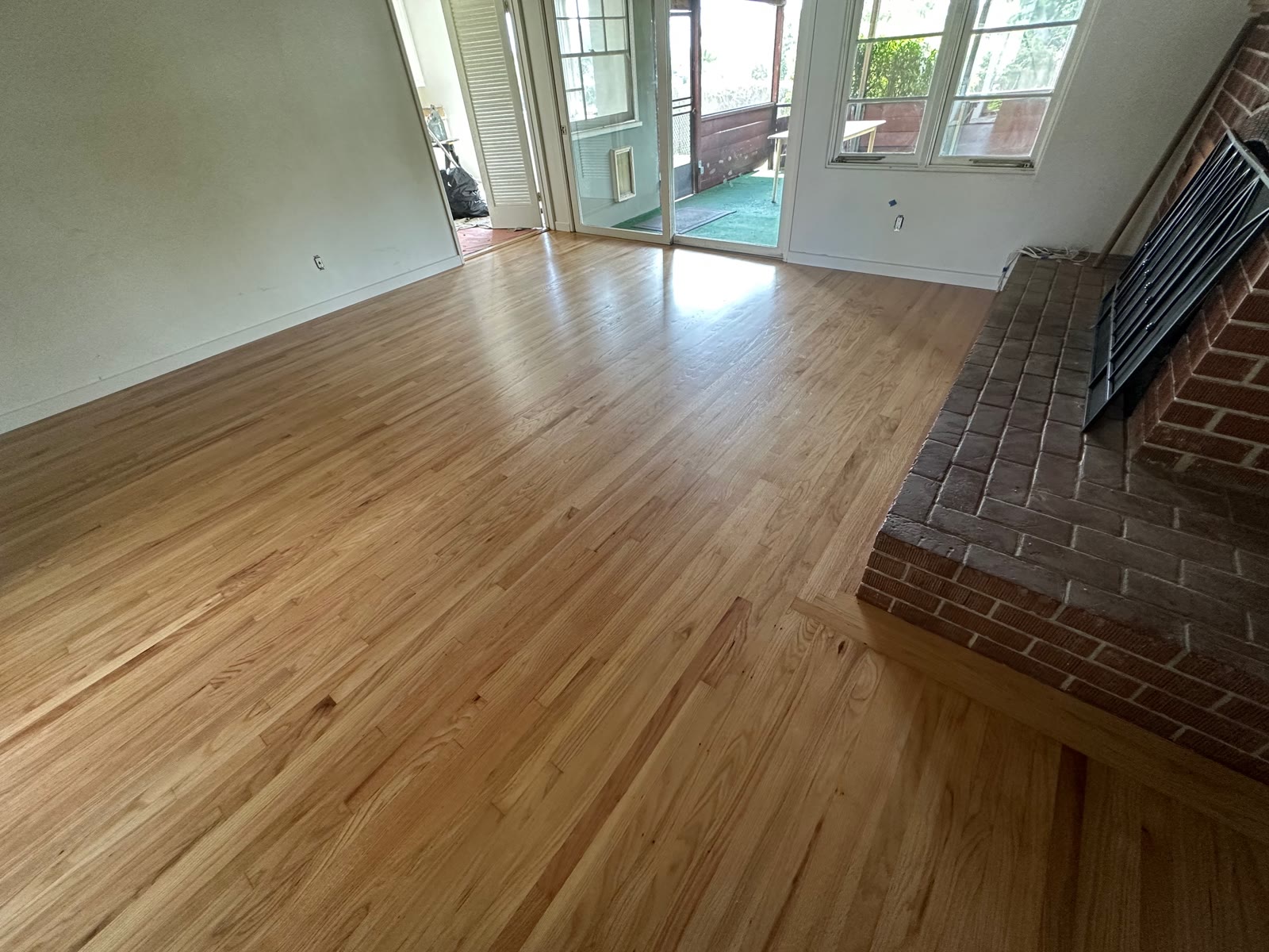 Refinished red oak floor in natural tone across a La Jolla living room