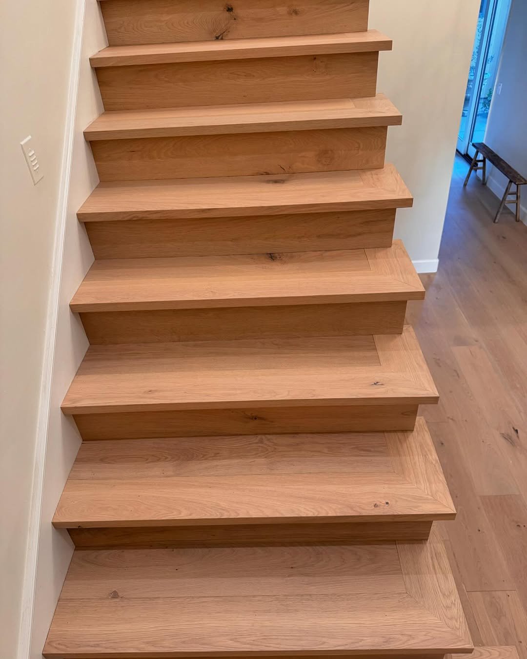 Custom hardwood flooring with detailed transitions